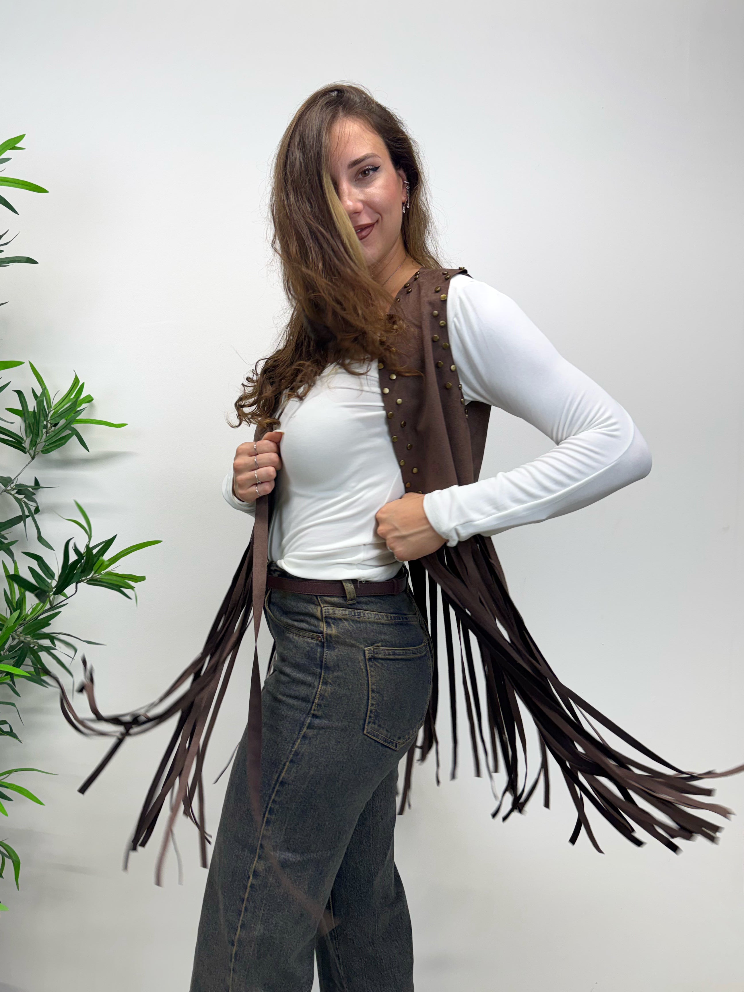 Gilet con frange e borchiette